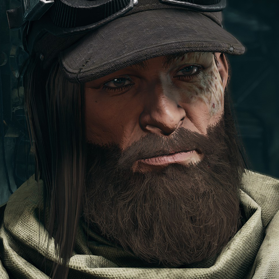 Nulloch, a bearded craggly man with long dark hair, wearing a cap with goggles.